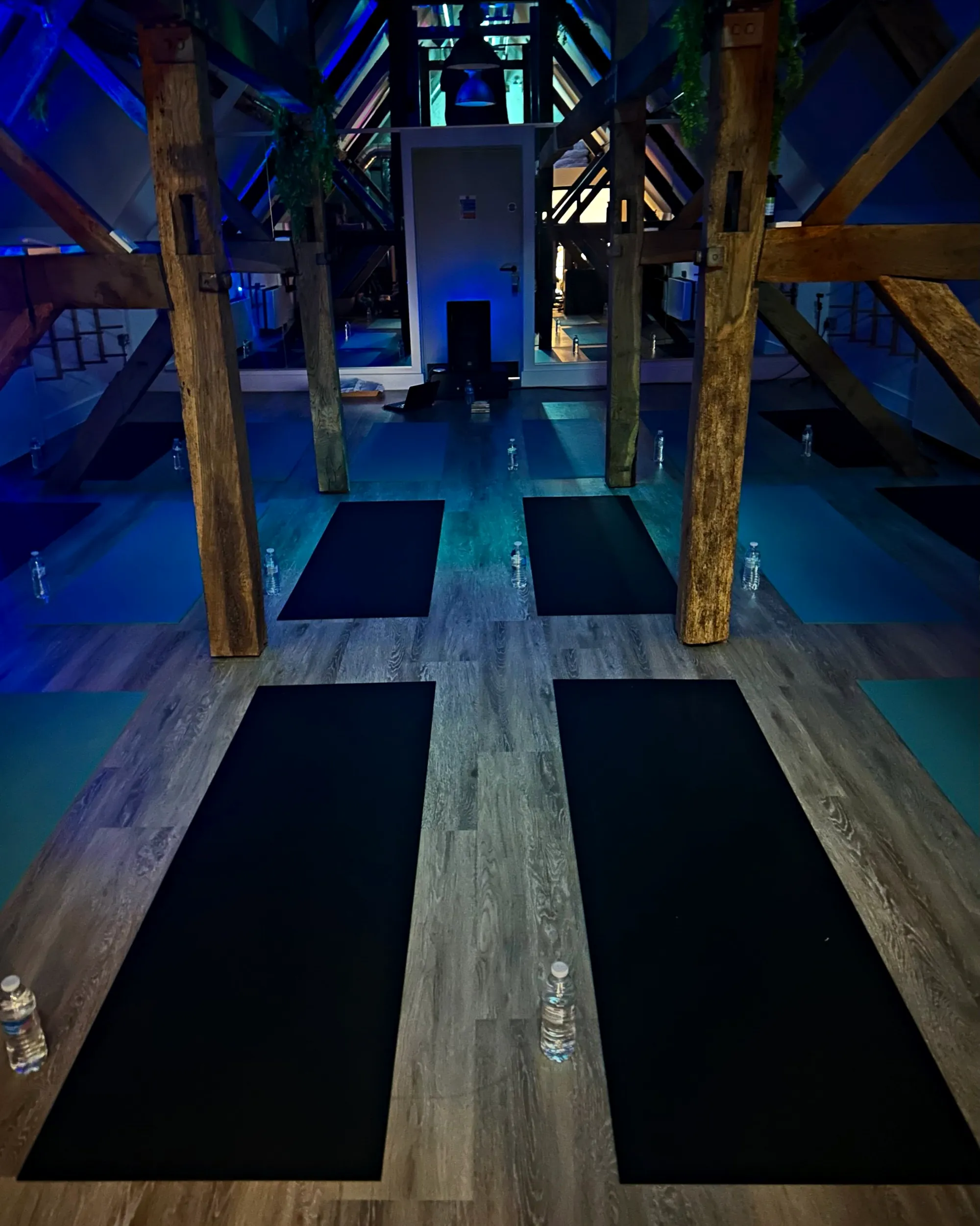 The oak beamed loft studio, mats laid out under blue light